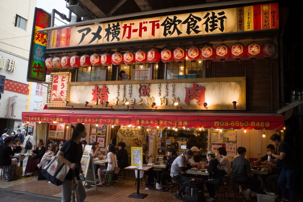 Customers dine at a restaurant on the Ameyoko shopping street in Tokyo, Japan. Photo: Bloomberg