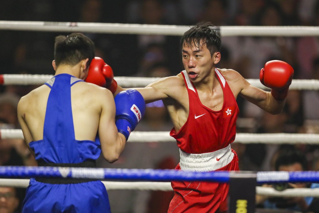 Rex Tso (red), who suffered a disappointing return to the ring after losing his first bout in 18 months to Wang Xinyan in the National Games round of 16 encounter, in action at the Southorn Stadium in Wan Chai. Photo: Winson Wong
