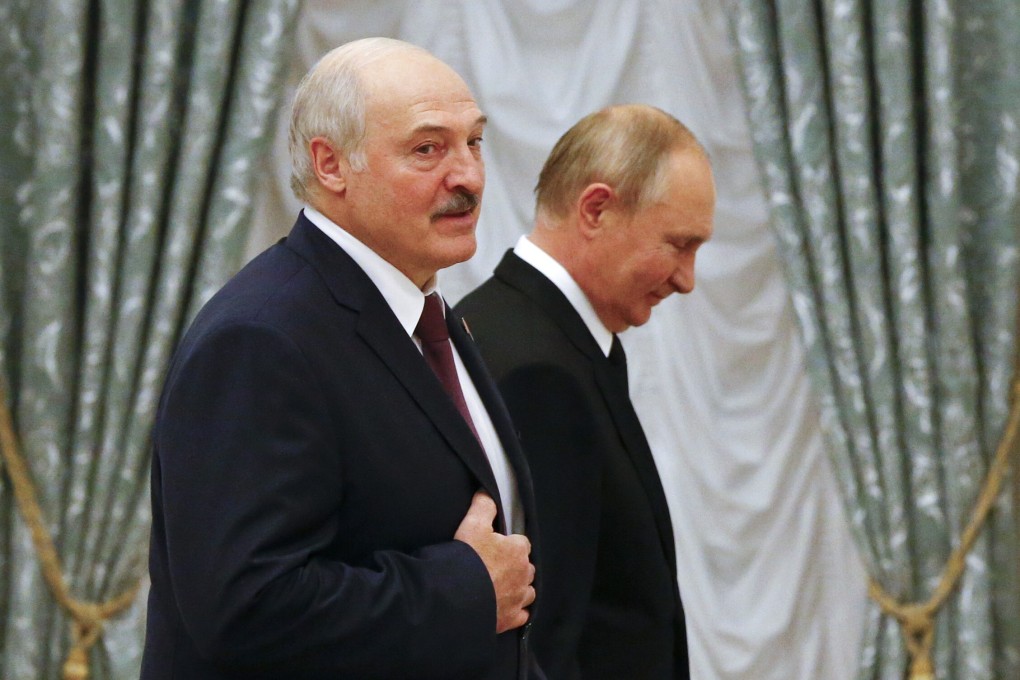 Belarusian President Alexander Lukashenko (left) and Russian President Vladimir Putin walk in the hall during a joint press conference in the Kremlin on Thursday. Photo: AP