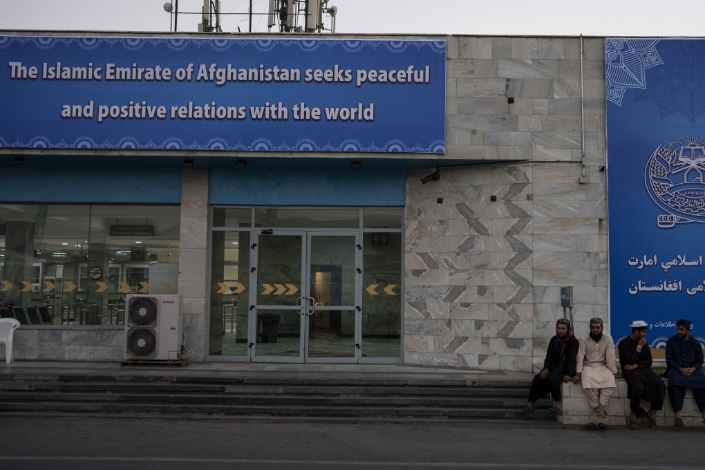 Taliban members and airport staff are seen outside Kabul’s airport. While the new regime in Afghanistan seeks diplomatic recognition, its neighbours are working out how to deal with its takeover. Photo: AP