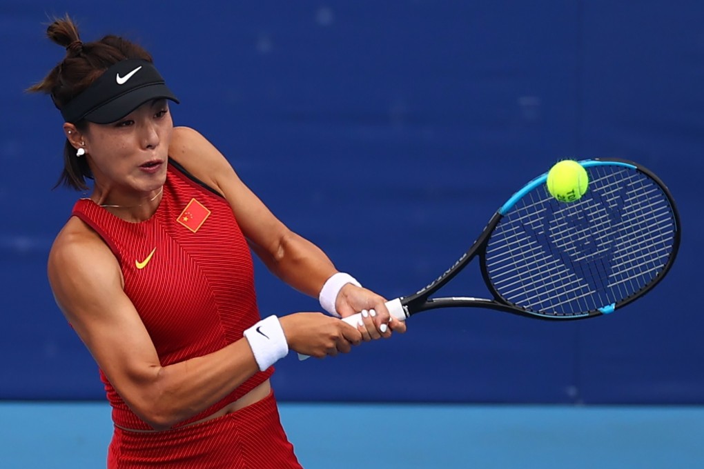Wang Qiang of China in action during her Tokyo 2020 Olympic Games second-round match against Garbine Muguruza of Spain. Photo: Reuters