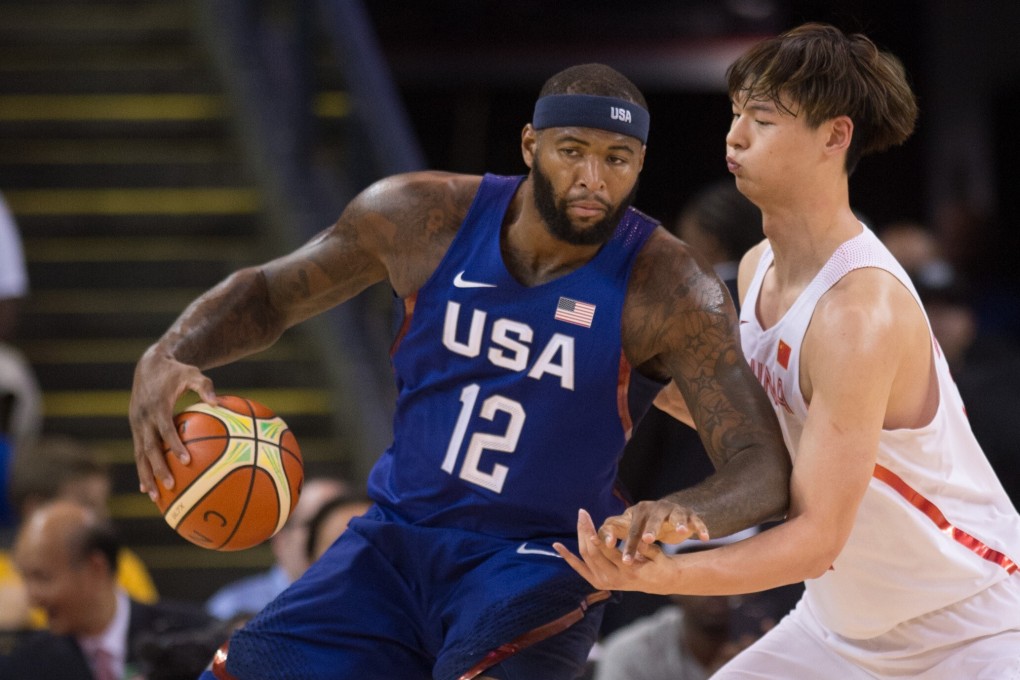 Wang Zhelin of China vies with DeMarcus Cousins of the USA during a 2016 friendly match at the Oracle Arena in Oakland, California. Photo: Xinhua