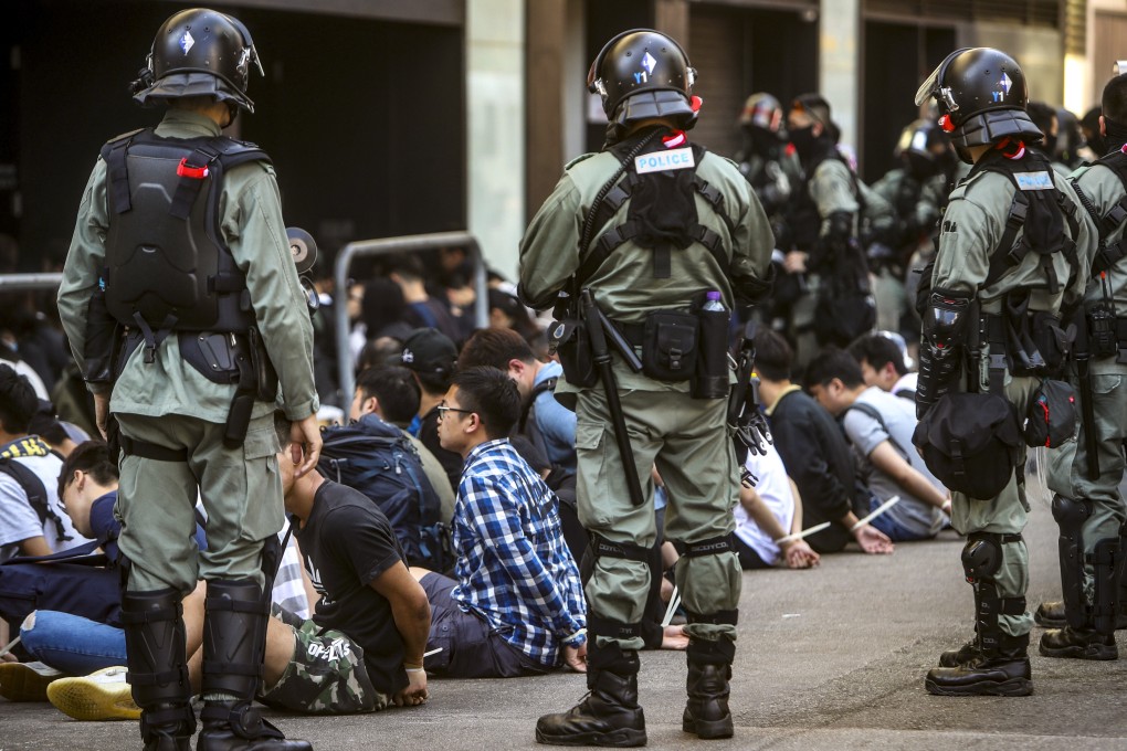 Riot police make arrests after clashes with protesters at the Polytechnic University in Hung Hom in November 2019. Photo: Winson Wong