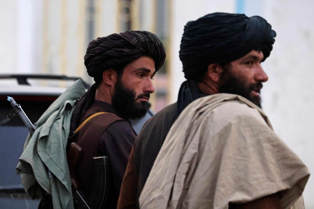 Taliban fighters patrol along the airport in Kabul, Afghanistan on Saturday. Photo: AFP