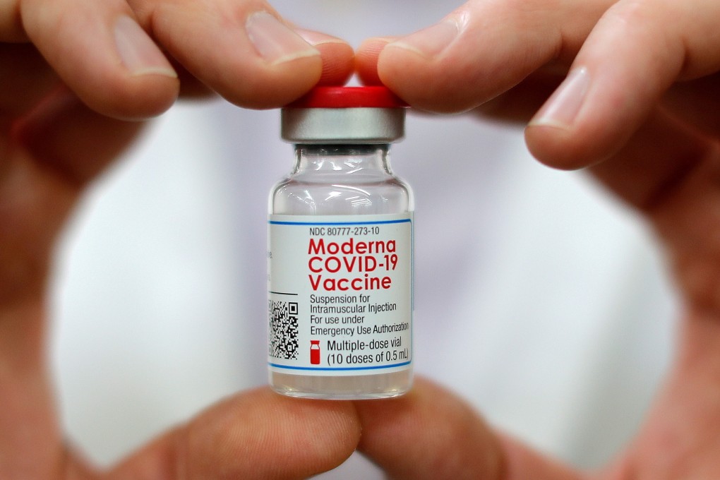 A pharmacist holds a vial of the Moderna coronavirus vaccine. A study found efficacy against hospitalisation was highest for the Moderna vaccine at 95 per cent. Photo: Reuters