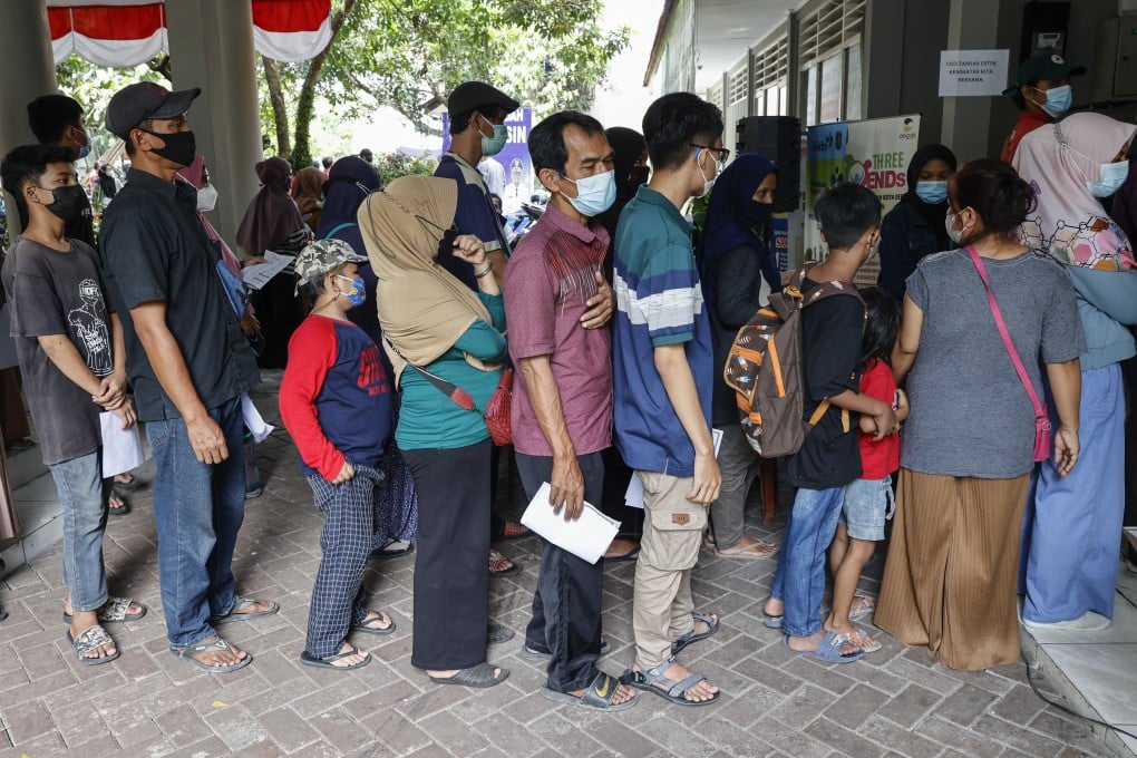Indonesians queue for Covid-19 vaccinations. The region’s biggest economy is focused on the long game in dealing with the pandemic. Photo: EPA-EFE