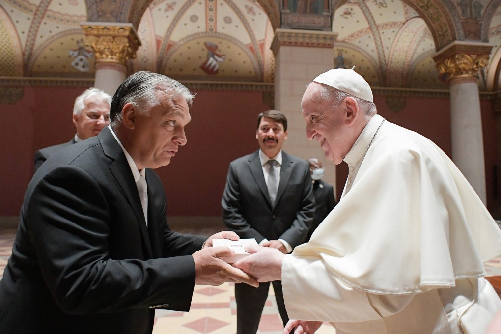 Pope Francis and Hungarian Prime Minister Viktor Orban, left, and Hungarian President Janos Ader, centre at back, in the Romanesque Hall of the Museum of Fine Arts in Budapest, Hungary on Sunday. Photo: Vatican Media / AFP