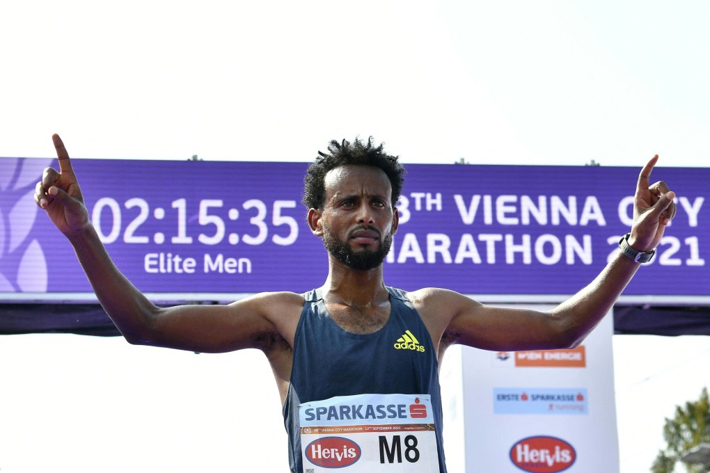Ethiopia's Derara Hurisa celebrates winning the Vienna City Marathon before he is disqualified for non-regulation shoes. Photo: AFP
