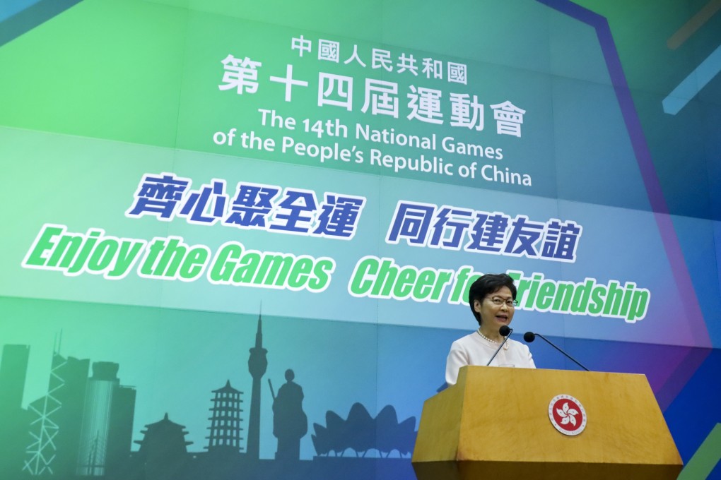 A banner behind Carrie Lam on Tuesday used the wrong Chinese characters to spell out the country’s name, prompting an apology after the press briefing. Photo: Handout