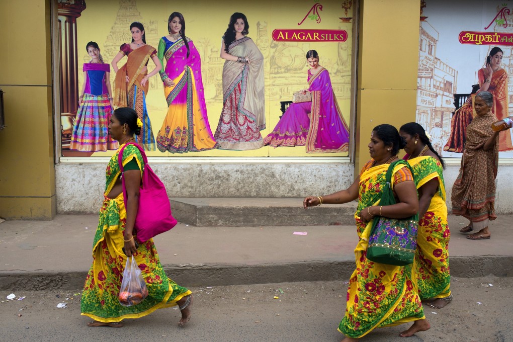 Women in saris in Tamil Nadu, which has just granted workers the right to sit. Photo: Getty Images