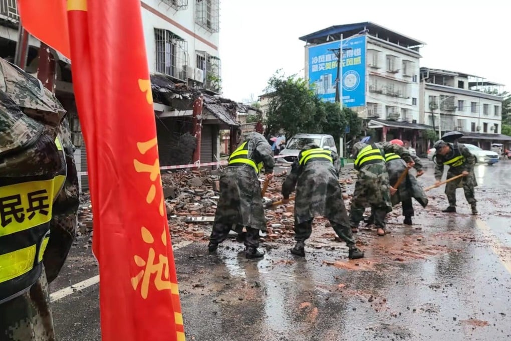 Rescuers removing debris on a street in Fuji Town of Luxian County, southwest China’s Sichuan Province. Photo: Xinhua