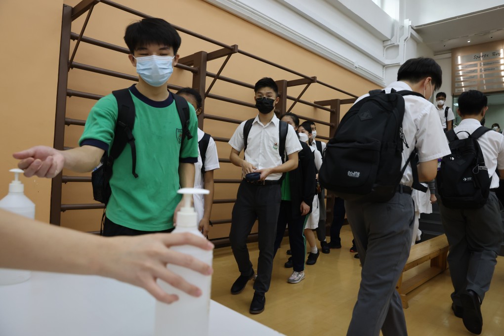Students use hand sanitiser before beginning their day at Delia Memorial School (Hip Wo) in Kwun Tong on Monday. Photo: Nora Tam