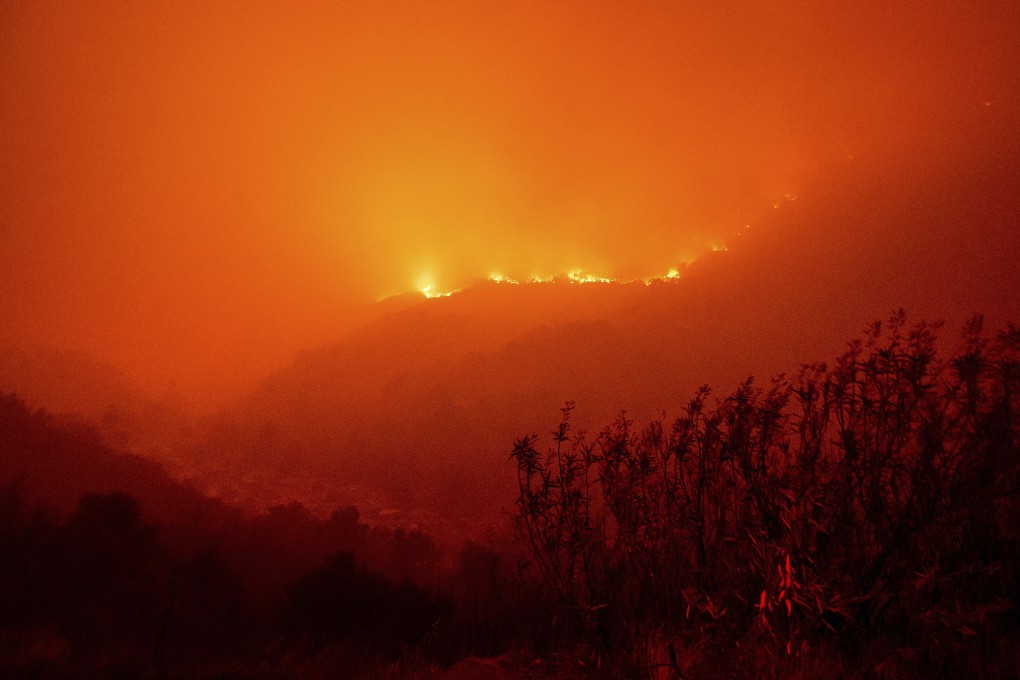 Flames from the KNP Complex Fire burn along a hillside above the Kaweah River in Sequoia National Park, California, on Tuesday. Photo: AP