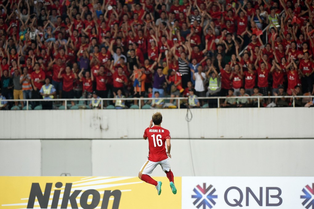 Huang Bowen celebrates netting Guangzhou Evergrande's equaliser against Japan's Gamba Osaka during the 2015 AFC Champions League semi-final first leg in Guangzhou. Photo: Xinhua