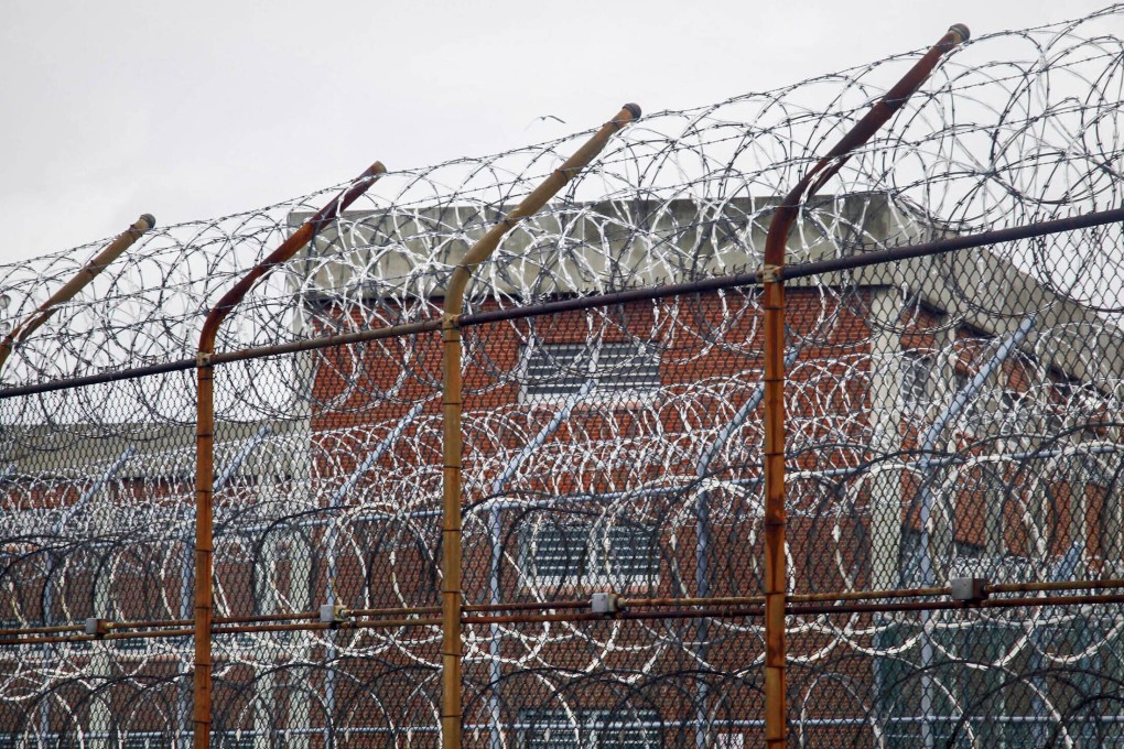 A barbed wire fence is seen outside inmate housing on New York's Rikers Island correctional facility in March 2011. Photo: AP
