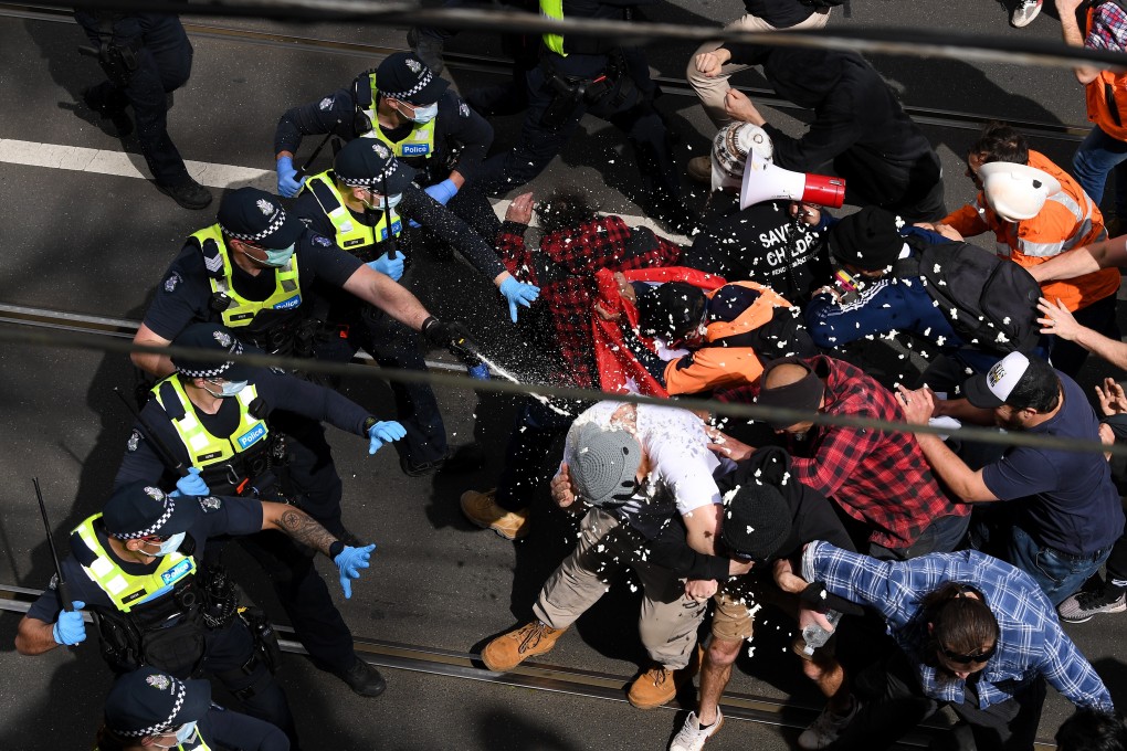 Victorian police officers used pepper spray against protesters during Worldwide Rally for Freedom in Melbourne. Photo: EPA