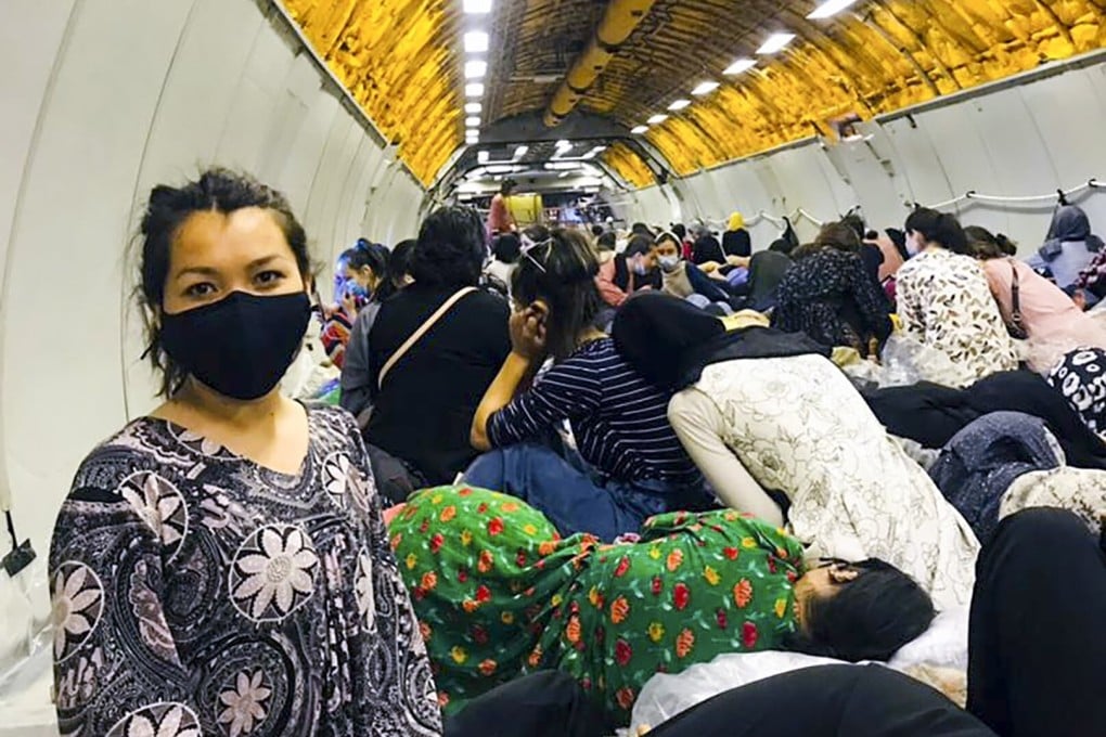Afghan student Humaira Zafari is pictured inside a US military plane out of Kabul, along with other Afghan civilians. Photo: Handout
