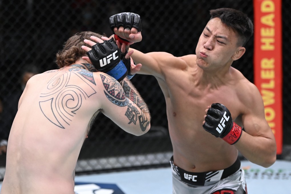 China’s Rong Zhu punches Brandon Jenkins in their lightweight fight at UFC Vegas 37. Photos: Jeff Bottari/Zuffa LLC