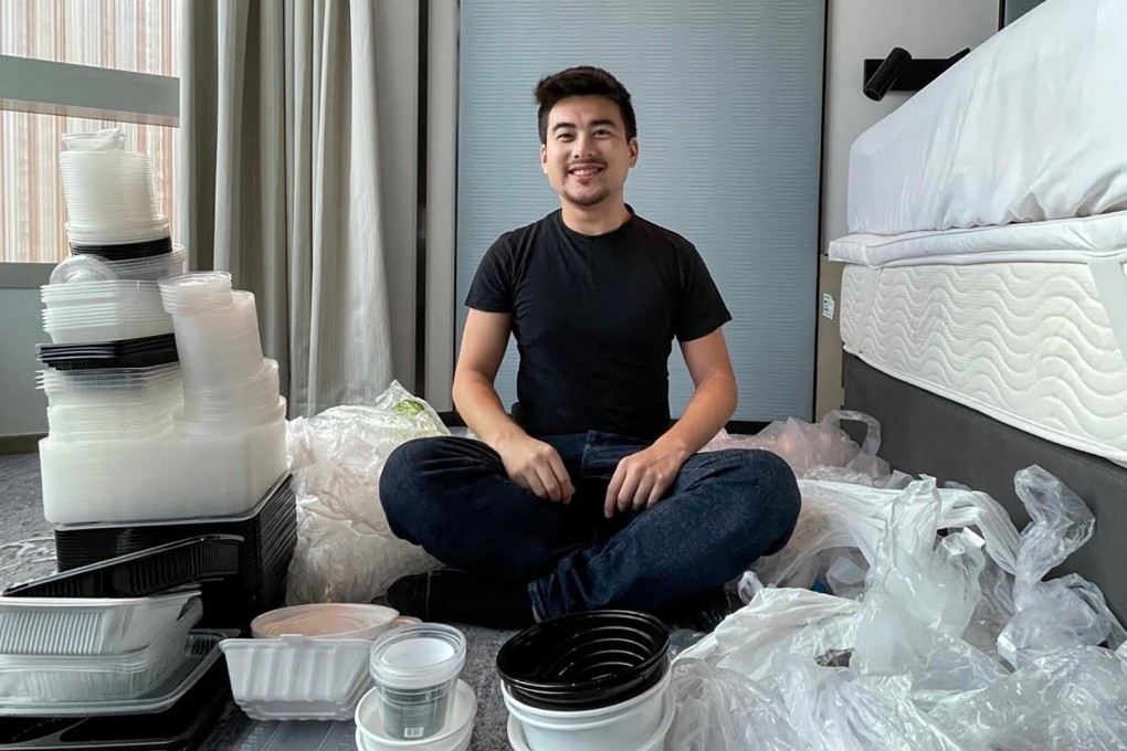 Sean Barry sits among the 288 pieces of plastic he collected for recycling during his 21-day quarantine in Hong Kong. Photo: Sean Barry