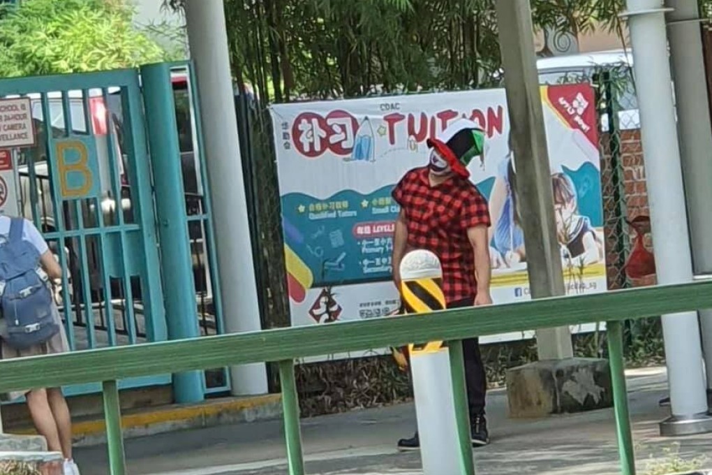A clown seen at outside a primary school in Singapore. Photo: Facebook