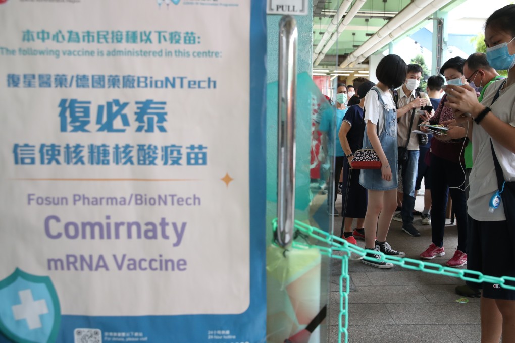 People queue to get the BioNTech vaccine at Choi Hung Road Badminton Centre. Photo: Edmond So