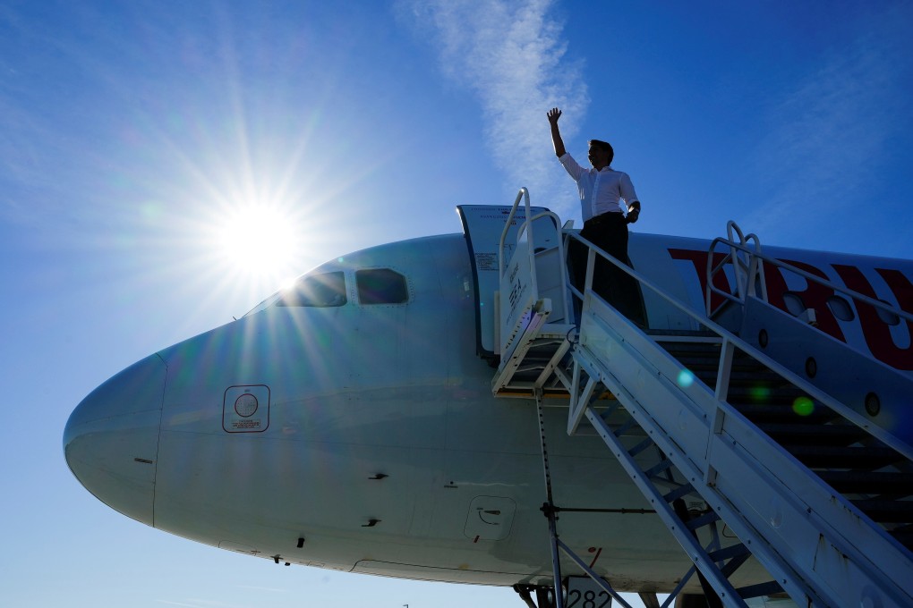 Canada's Liberal Prime Minister Justin Trudeau boards his plane on the last campaign day before the election, in Hamilton, Ontario. Photo: Reuters