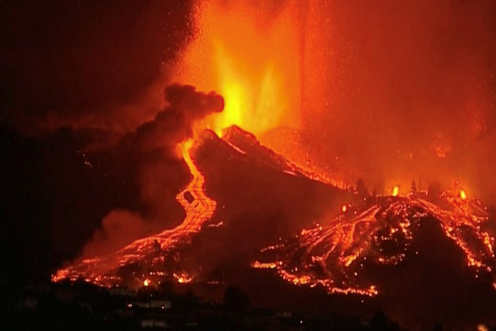 Lava pours out of a volcano in the Cumbre Vieja national park at El Paso, on the Canary Island of La Palma, Spain on Sunday. Photo: Reuters