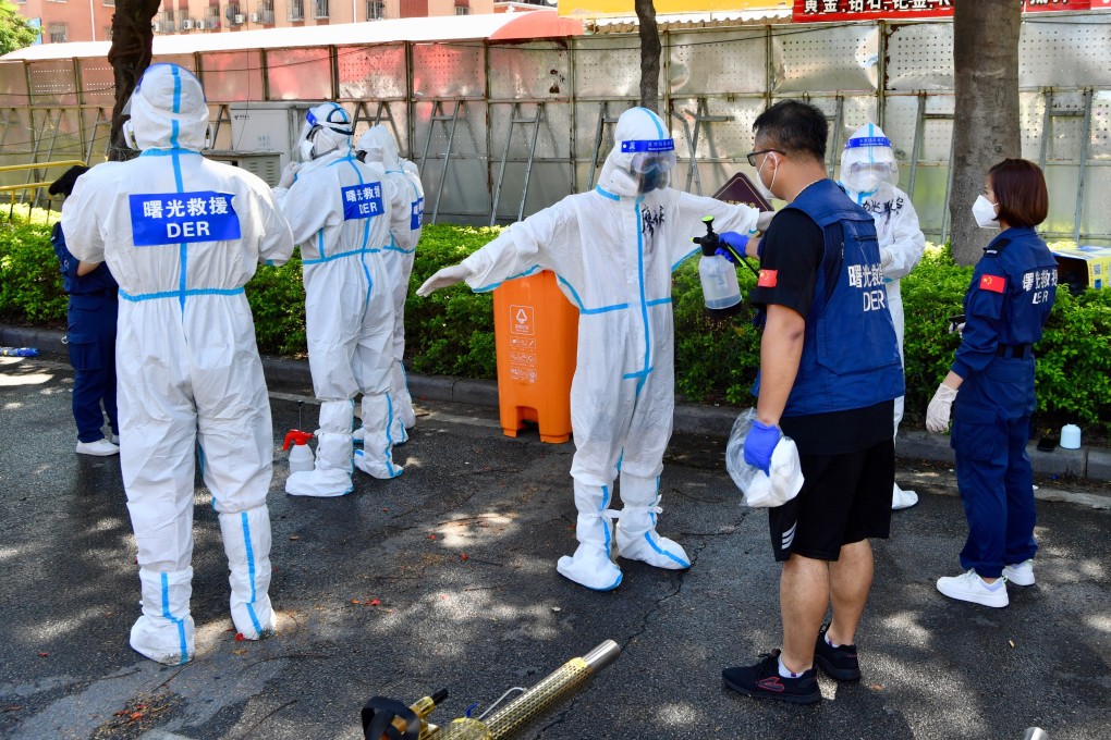 Volunteers are disinfected in Xiamen, one of three cities in China’s southeastern province of Fujian affected by an outbreak of the Covid-19 Delta variant. Photo: Xinhua