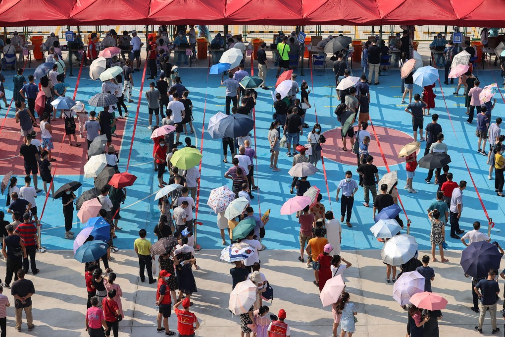 Residents of Xiamen in China’s Fujian province queue for mass Covid-19 testing. Photo: AFP