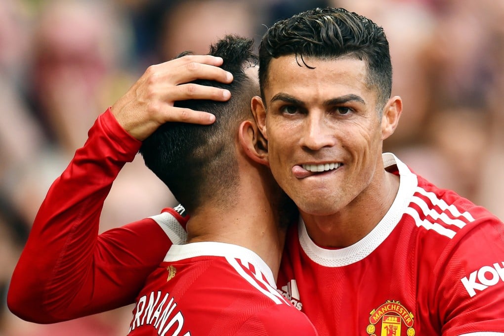 Cristiano Ronaldo congratulates Manchester United teammate Bruno Fernandes after a goal against Newcastle United in the English Premier League. Photo: EPA