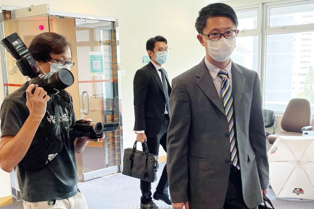 Dr Lam Chi-kwan (front) walks out of the sentencing session. Photo: Cat Wang