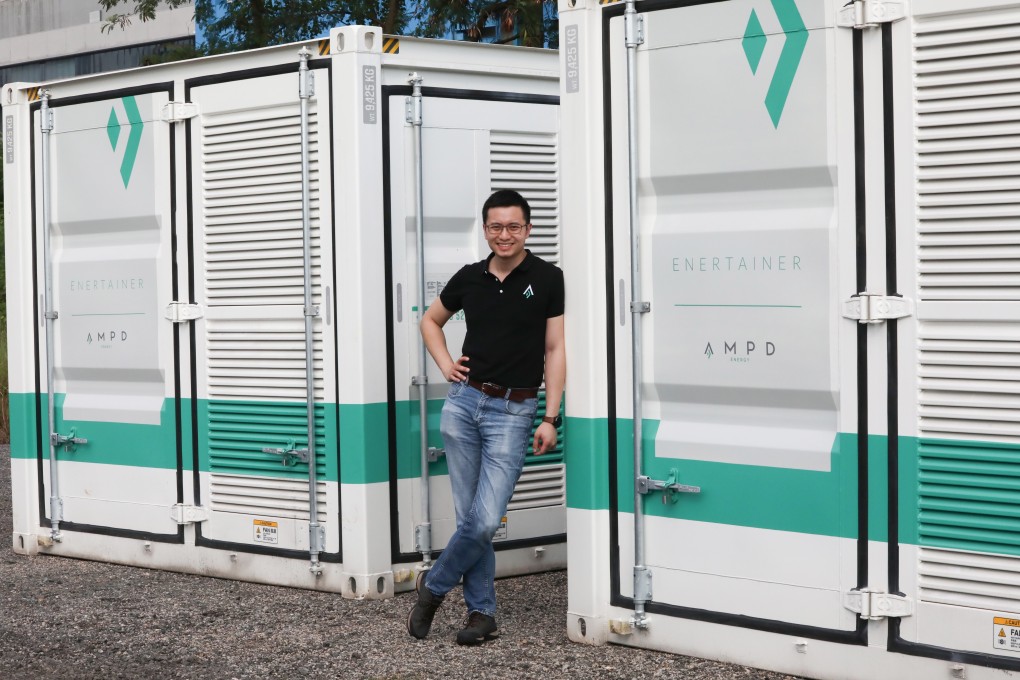 AMPD Energy CEO Brandon Ng with an AMPD Enertainer energy storage system, at Tseung Kwan O Industrial Estate. Photo: Jonathan Wong