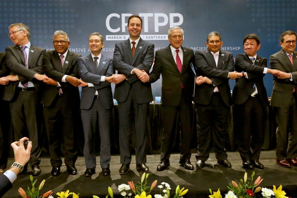 Trade ministers from 11 countries celebrate the signing of the Comprehensive and Progressive Agreement for Trans-Pacific Partnership in Chile in 2018. Photo: AP