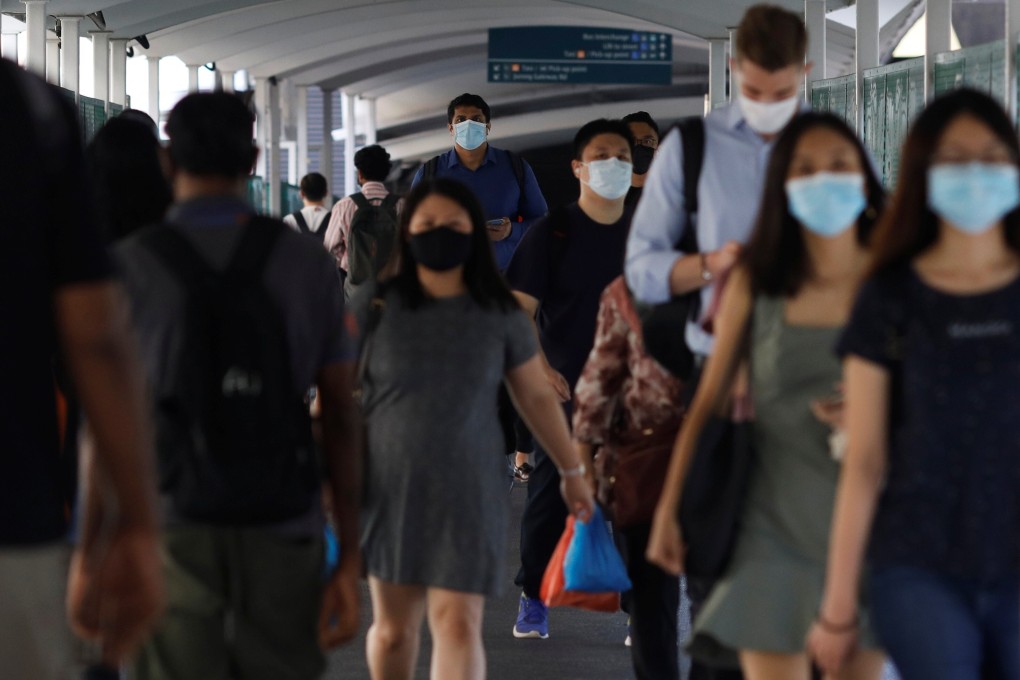 Commuters at a train station in Singapore. Photo: Reuters
