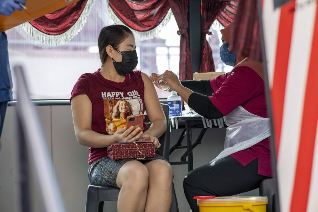 A woman gets vaccinated against Covid-19 in Selangor, Malaysia. Photo: Xinhua