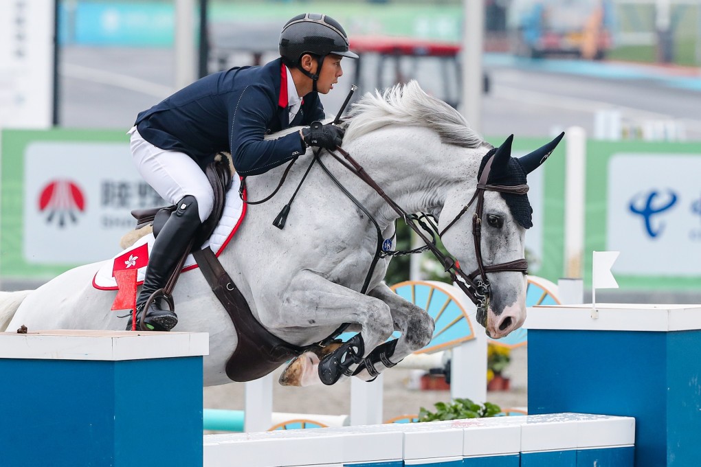 Hong Kong’s Kenneth Cheng and his horse Funchal in the showjumping qualifiers at the National Games in Xian. Photo: LCSD/Sports Road)