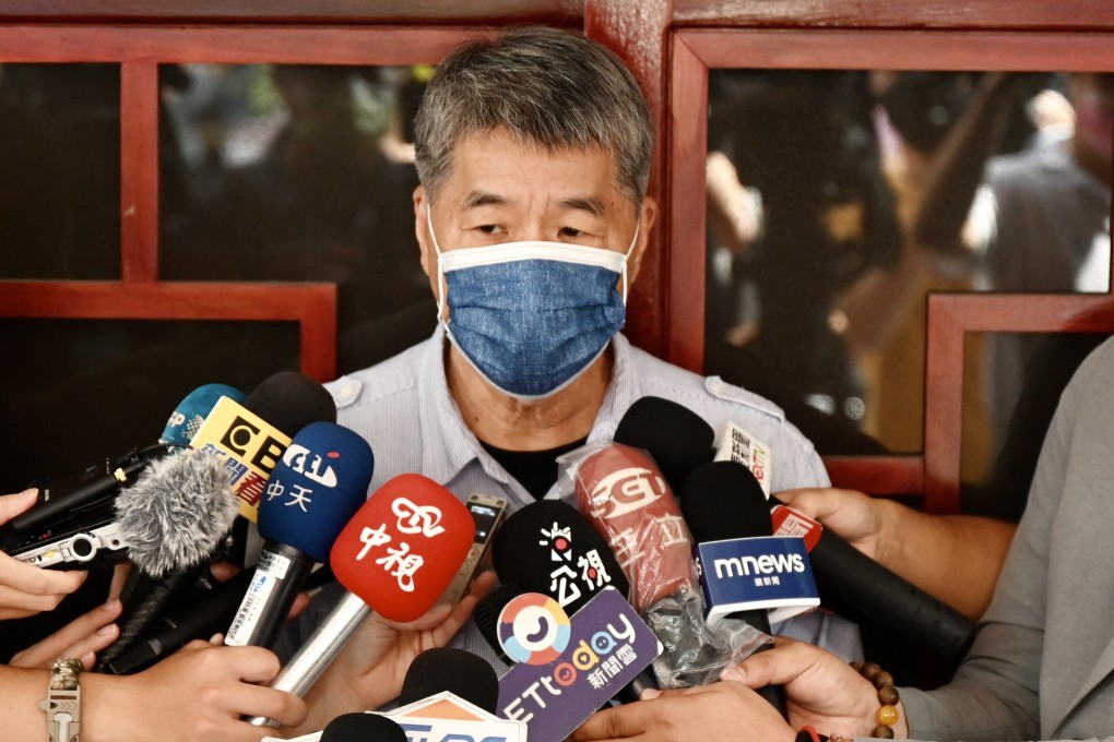 Chang Ya-chung, who has won over ‘deep blue’ hardline KMT members by openly embracing Taiwan reunification, speaks to the press after voting at a polling station in Taipei on September 25. Photo: AFP