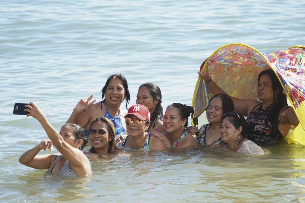 A group of friends enjoy the hot weather at Repulse Bay Beach. Photo: Winson Wong