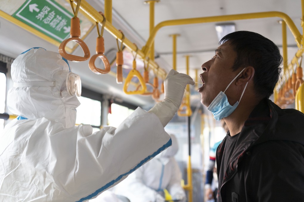 A medical worker collects swabs for nucleic acid testing at a mobile testing site in Bayan county in Harbin, Heilongjiang province, on September 24. Cases in the Harbin cluster have been identified as the highly transmissible Delta variant. Photo: Xinhua