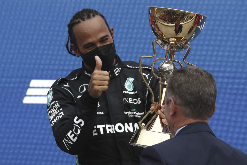 British Formula One driver Lewis Hamilton celebrates on the podium after the 2021 Formula One Grand Prix at the Sochi Autodrome racetrack in Sochi, Russia on Sunday. Photo: EPA-EFE