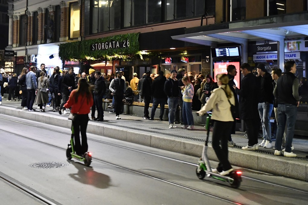 People celebrate the end of Covid-19 restrictions in Oslo on Saturday. Photo: AP