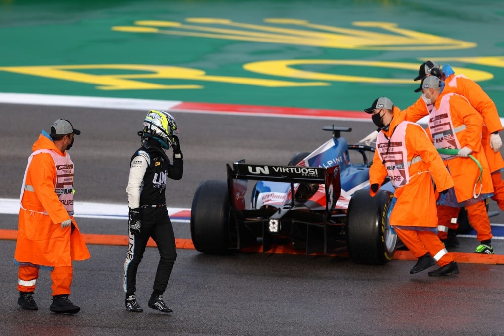 Zhou Guanyu of UNI-Virtuosi walks away from his car after a disastrous spin on his way to the starting grid ended his sprint race chances. Photo: Bryn Lennon/Getty Images
