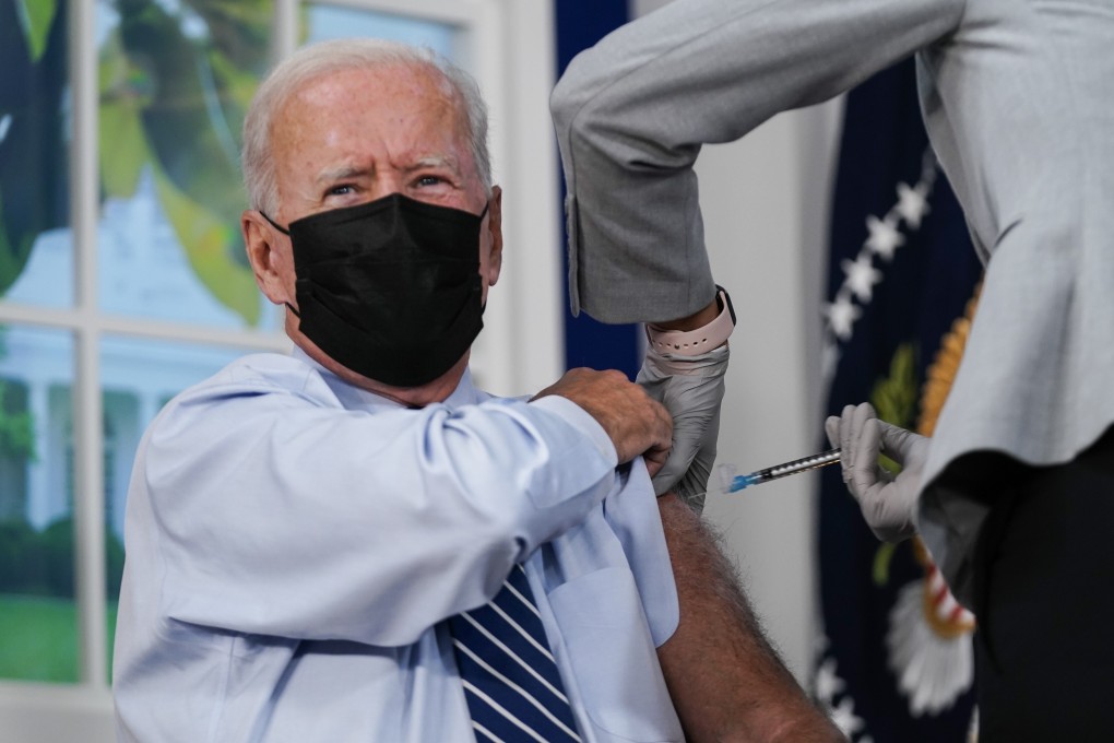 US President Joe Biden receives a Covid-19 booster shot in line with the CDC's and FDA's recommendations in Washington on Monday. Photo: EPA-EFE