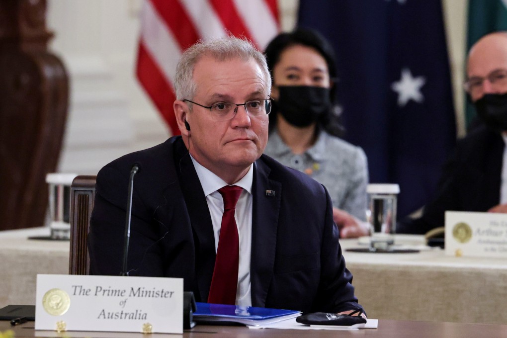 Australia’s Prime Minister Scott Morrison is seen seated with members of his delegation as he participates in a ‘Quad nations’ meeting in the East Room at the White House in Washington on Friday. Photo: Reuters