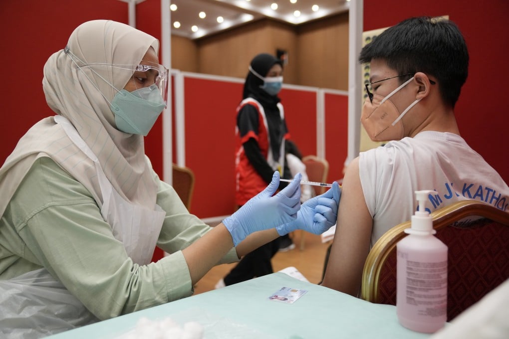 A secondary school student receives a dose of the Pfizer vaccine in Shah Alam, Malaysia. Photo: AP