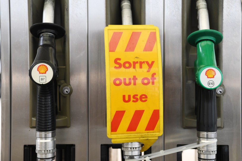 An “out of use” sign is seen at a fuel pump at a petrol station in London on Monday. Photo: EPA-EFE