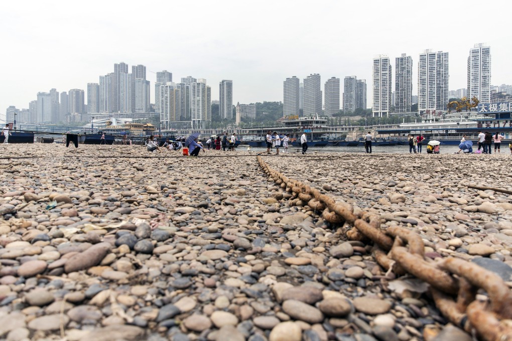 People gather along the Yangtze River in Chongqing, China, on June 1. Photo: Bloomberg