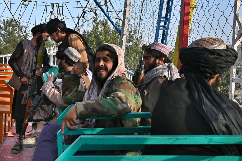 Taliban fighters on a pirate ship ride on the outskirts of Kabul. Photo: AFP