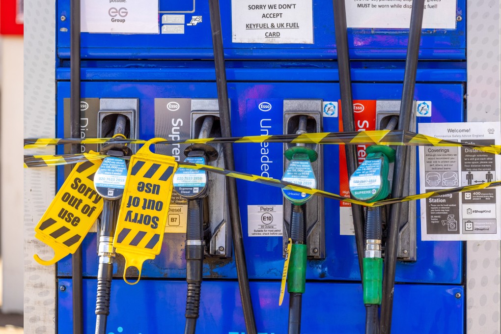 Closed fuel pumps on the forecourt of an Esso petrol station near Guildford, a town in southern England. Photo: Bloomberg
