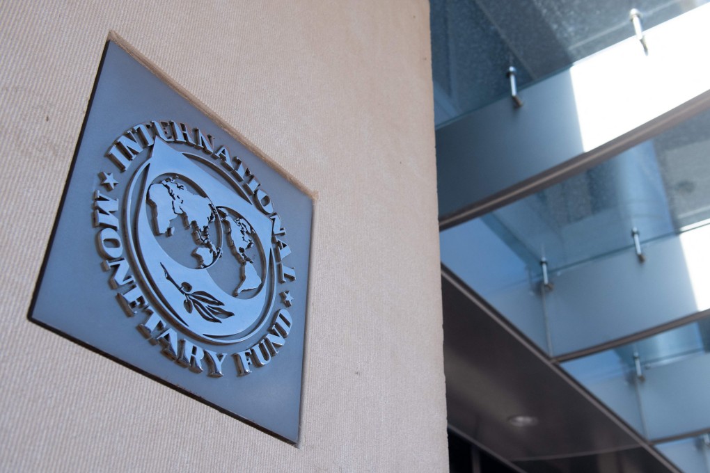 In this file photo taken on April 15, 2020 a sign is seen outside the headquarters of the International Monetary Fund (IMF). Photo: AFP